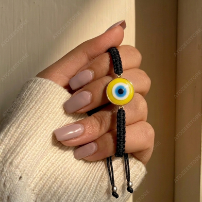 Yellow Evil Eye Black Cord Bracelet held in hand - Wear Protection Feel Powerful - Atozee Store