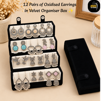 Oxidised silver-tone earrings collection and velvet organiser box shown in a festive jewellery display