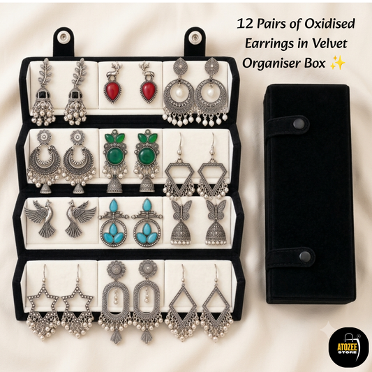 12 pairs of oxidised silver-tone earrings and black velvet organiser box in a product display